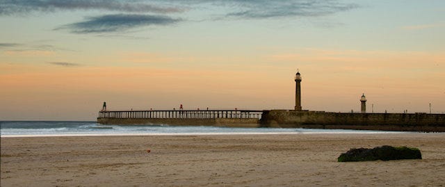 View of a harbour wall with lighthouses