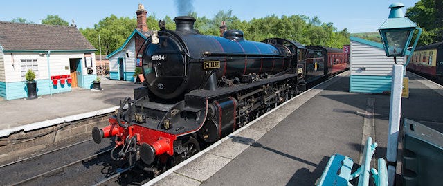 Black steam train at the station