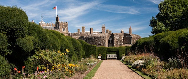 View down a path through manicured gardens, towards Deal Castle