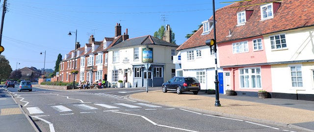 cars on a road in a town in Suffolk