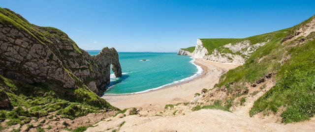 sandy path leading to a beautiful bay