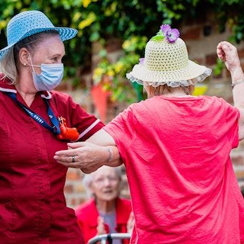 Care home residents dancing