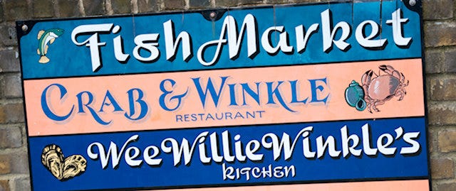 fish market sign on a wall