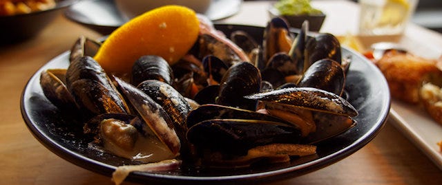 large bowl of muscles