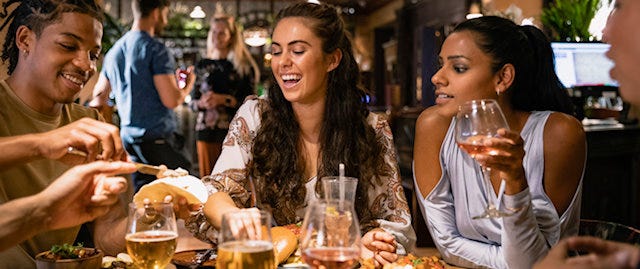 Group of friends having dinner at a pub 