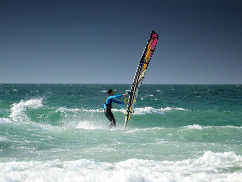 Surfer at Gwithian Beach