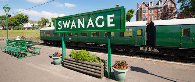 "Swanage" sign on the platform at Swanage Railway