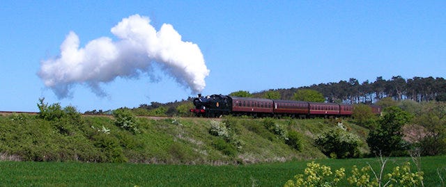 Steam train crossing the countryside