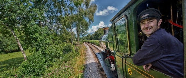 Train driver in an old steam train