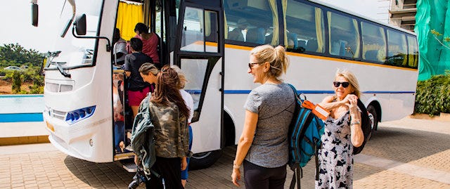 Travellers boarding a coach