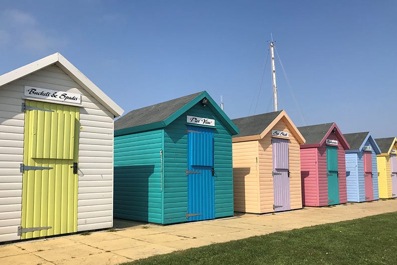 Colourful beach huts along the seafront