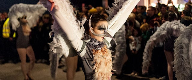 Girl dressed in bird costume at droving festival