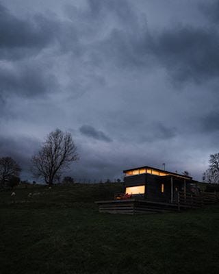 A dark sky above a small holiday lodge