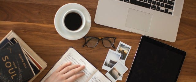 laptop and coffee on desk with laptop