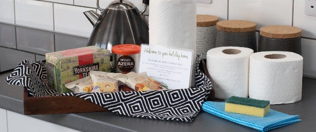 Welcome pack with toilet rolls and kitchen cloths
