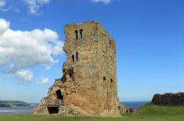 The tall ruin of Scarborough Castle on the Yorkshire coast