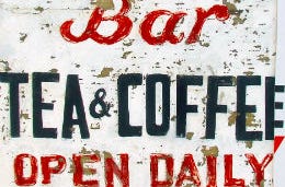 A sign advertising tea and coffee
