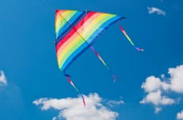 Kite-flying is always a fun family activity Cloud flying in a blue cloud