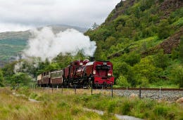 The Snowdon Mountain Railway engine puffing along the countryside in North Wales