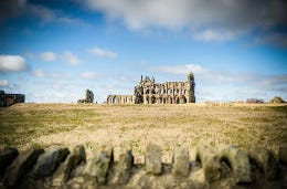 Ruined old Yorkshire building under blue skies