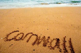 Cornwall written in the sand on a Cornish beach