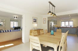 Bright and spacious modern kitchen with dining table enough for eight