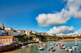 Boats in a harbour with coloured houses