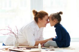 Mother and daughter on a table top