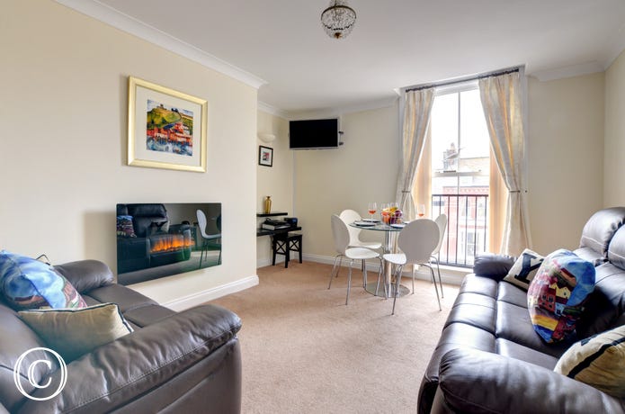 There is a spacious open plan lounge/diner with adjoining kitchen.