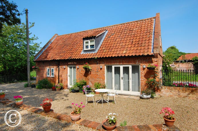 Partridge Farm is a pretty cottage built of soft red brick with an attractive pantile roof, in the grounds of the owners home.