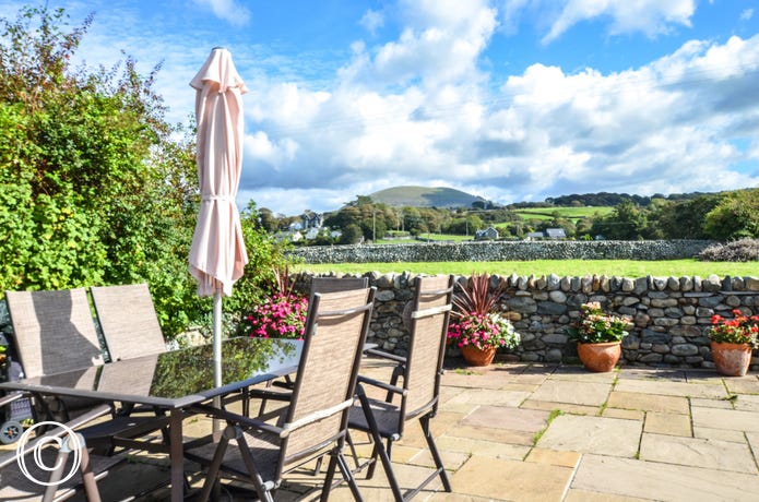 The patio are has lovely views over village and fields to the mountains