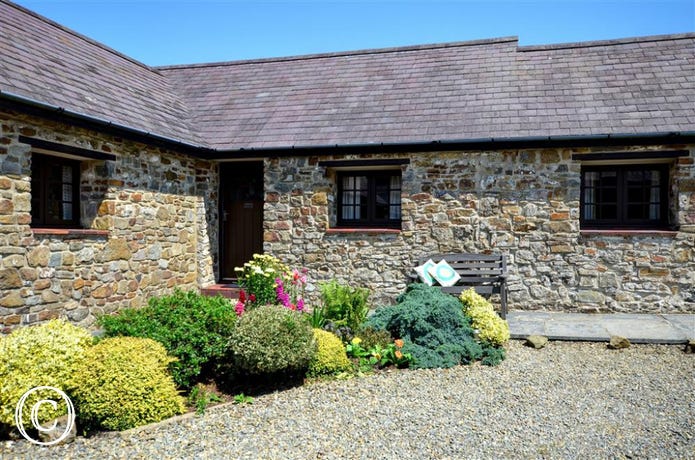 Wishing Well is in the corner of this L shaped group of cottages