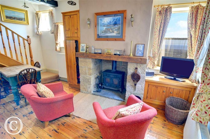 The Kitchen also has a cosy seating area with an open fire and TV.