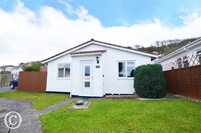 Summer Breeze is a delightful detached bungalow with lovely distant sea views