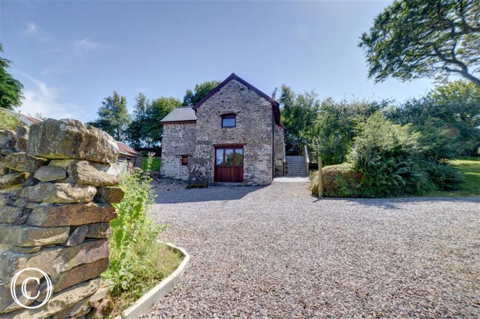 Peacefully located amid spectacular countryside, this detached barn conversion cottage has been newly renovated to high standards throughout