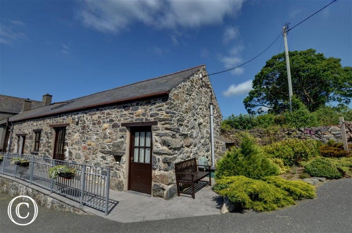 Carnedd Llewelyn is a stone cottage, mostly single storey and wheelchair accessible