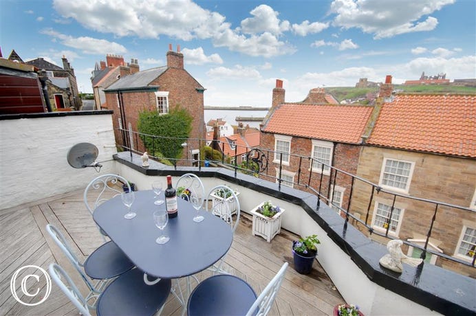 The Roof Terrace is accessed from the second floor bedroom. The patio furniture is perfect for sitting out and relaxing on a warm Summer's eve.