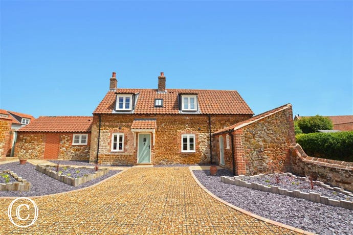 Exterior image of this traditional carrstone cottage