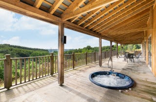 Hot tub in the decking overlooking the countryside views