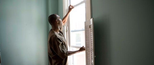 man fixing a window