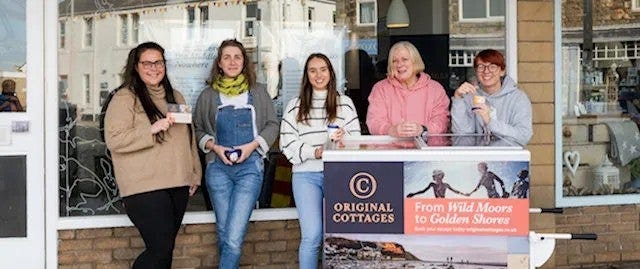 Team outside office with branded ice cream cart